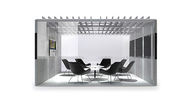 Modern office conference room with white walls, a round table, and chairs. rent furniture